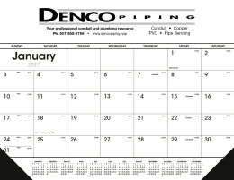 Desk pad calendar with vinyl corners showing black and white grid imprint